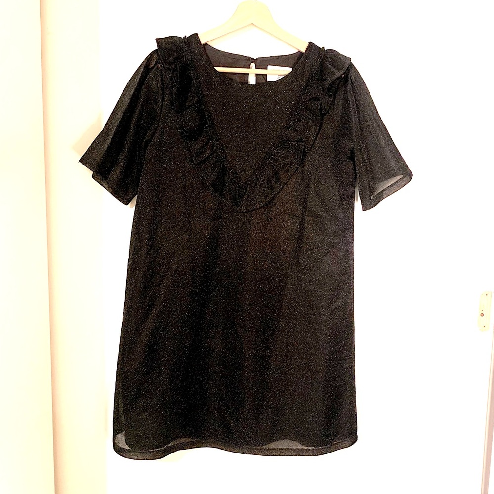 Black sparkly mini dress with puff sleeves and sweetheart ruffle.